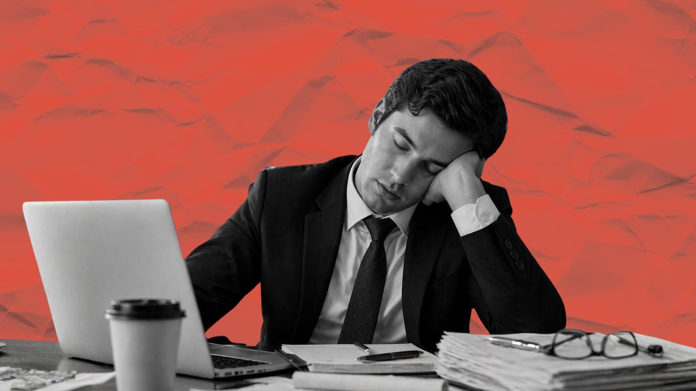 Male lawyer dozing at his desk due to lack of sleep. 