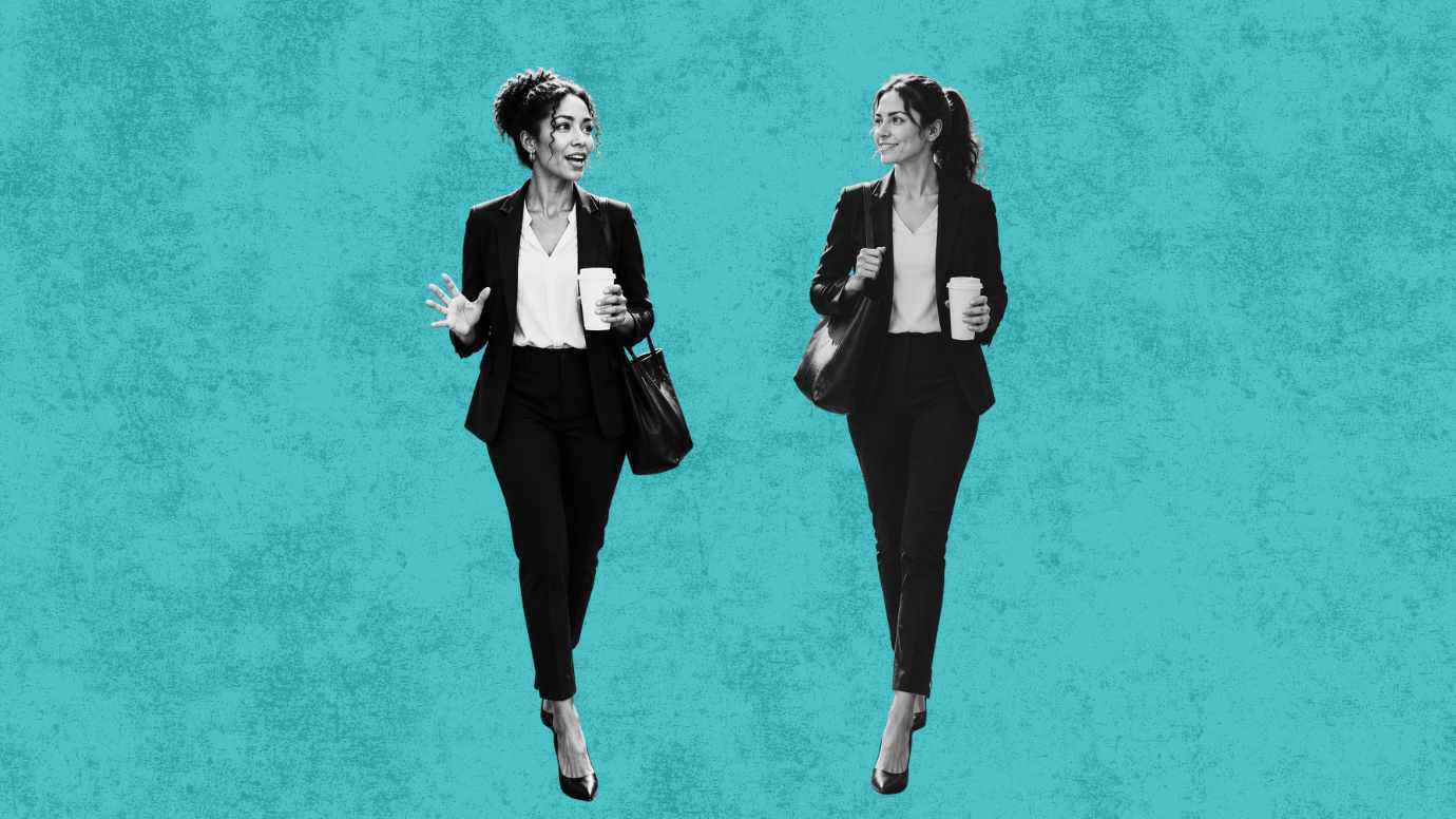 Two female attorneys taking a coffee walk