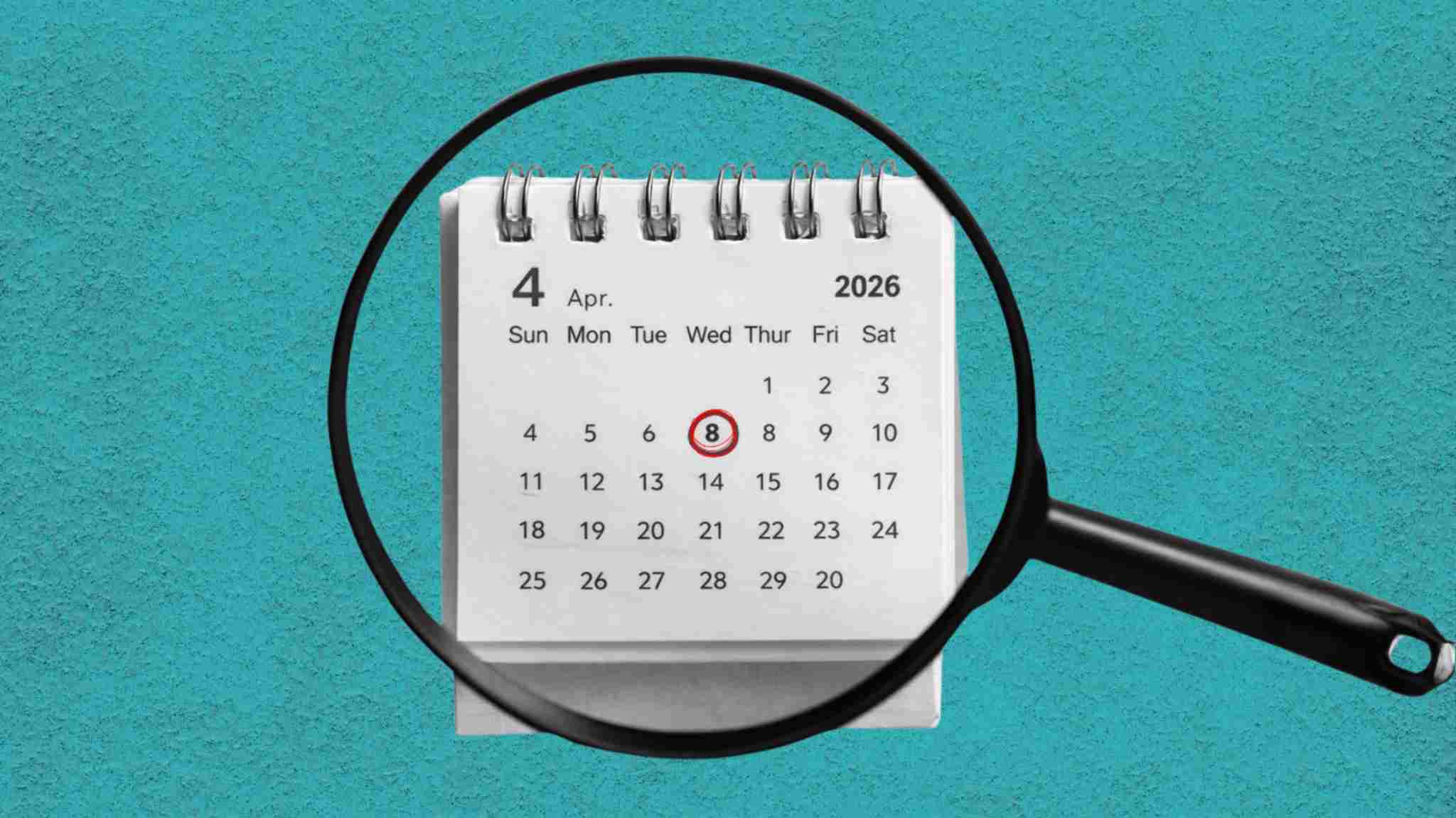 Magnifying glass zooming in on a calendar. 