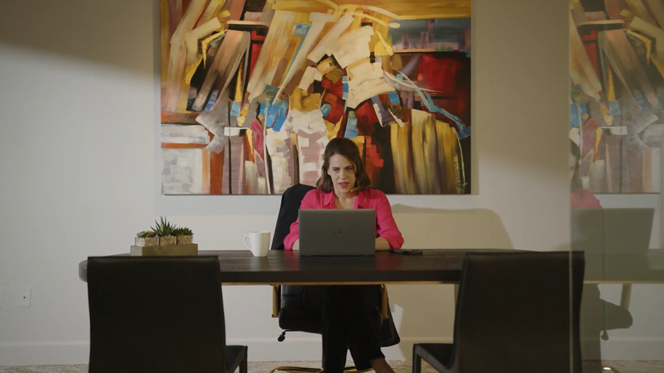 Female solo attorney working at her desk