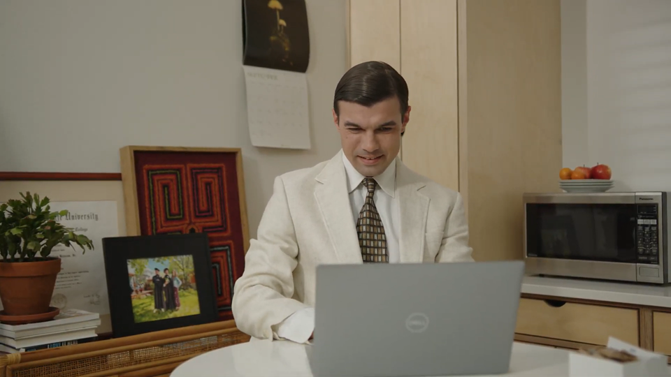 Young solo attorney sitting at laptop